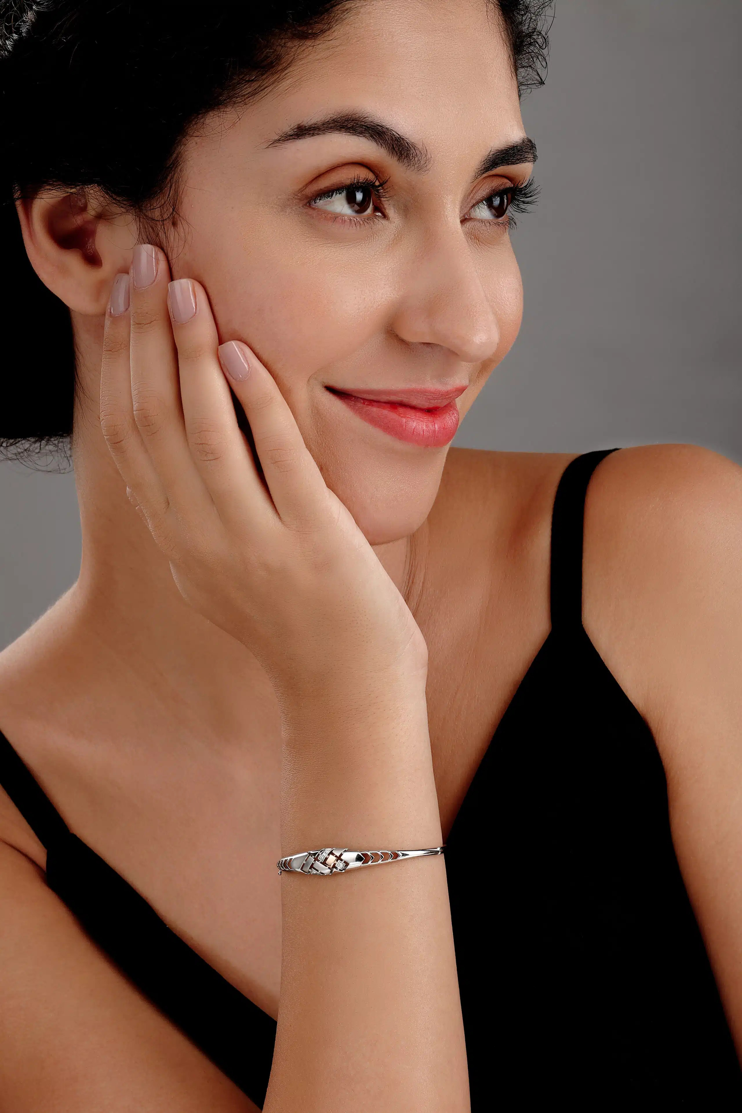 International female model posing for a platinum bracelet she is wearing on her hand, posing for the photographer pankaj mathur in mumbai