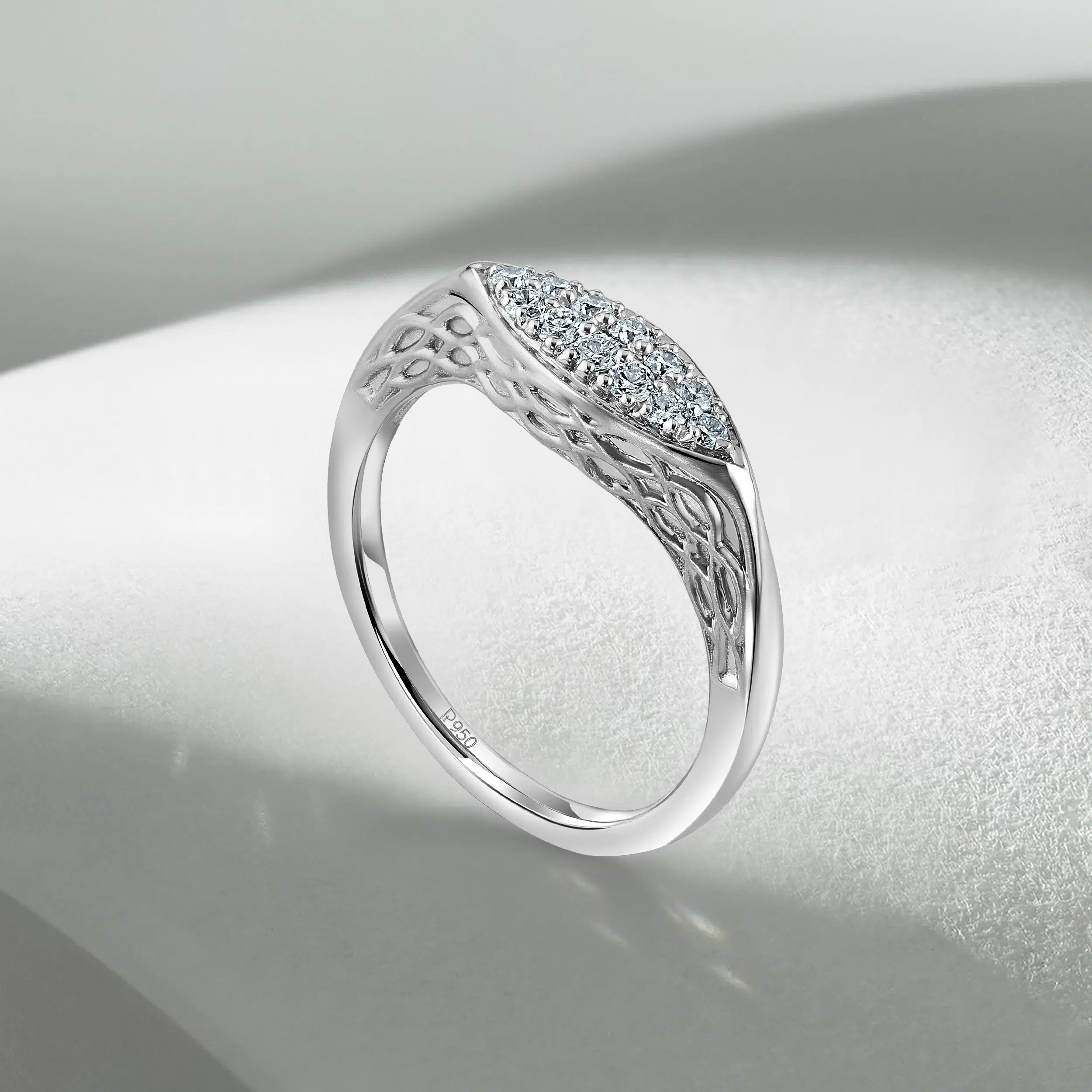 Diamond-studded platinum female ring photographed on creative, shaded background in andheri west mumbai photo studio