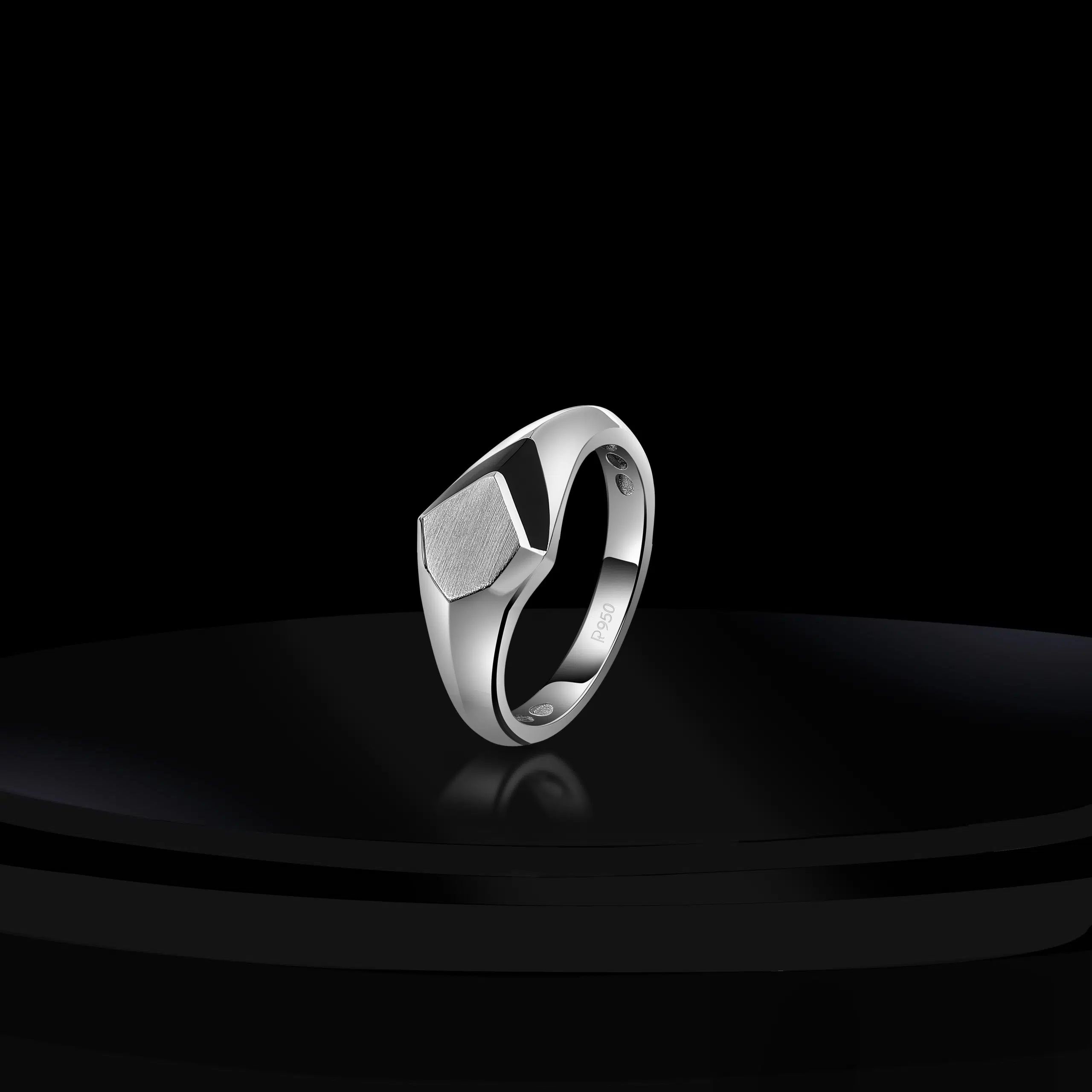 Platinum jewelry shoot from top angle on creative black ground to show case it's motif & design.
