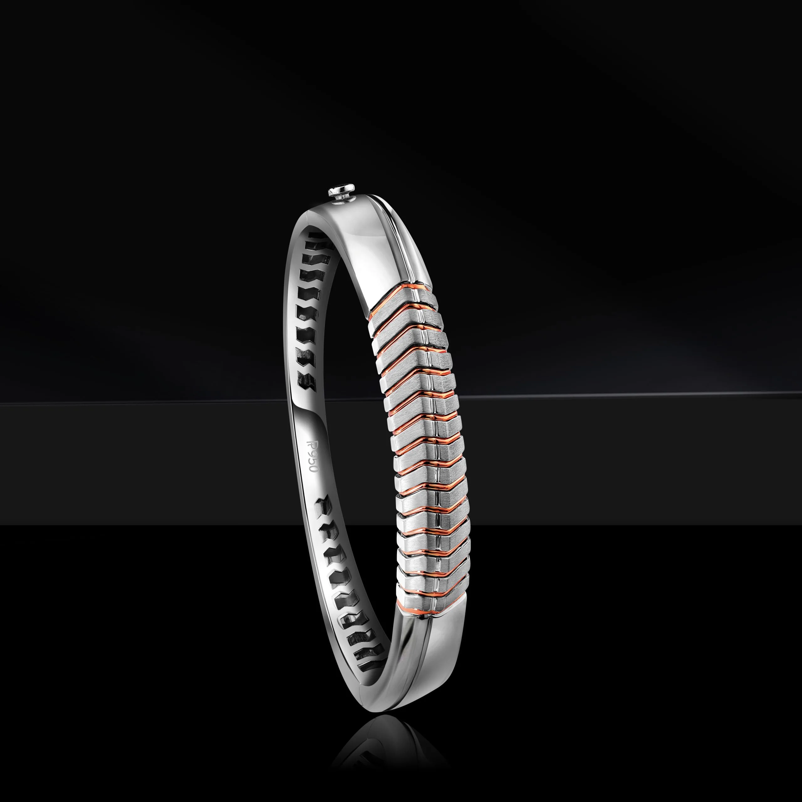 Men's solid bangle photoshoot against a black prop and black background.