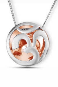 This image is of close-up shot of platinum and gold dual-tone pendant. Professional jewelry photography in mumbai india